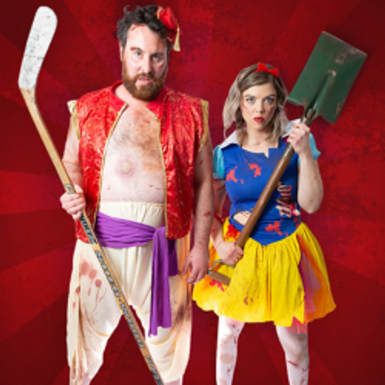 A man in an Aladdin costume and a woman in a Snow White costume holding a hockey stick and shovel staring at the camera. They look disheveled.