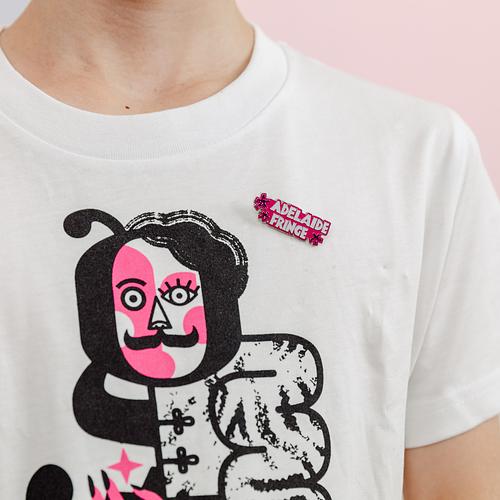 Person, wears white t shirt with pink Adelaide Fringe pin 